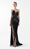 MNM Couture Style G2048 showcasing a strapless asymmetrical black crepe gown with anthracite lamé organza waves, crystal embellishments, and a dramatic thigh-high slit | Couture Shop LA