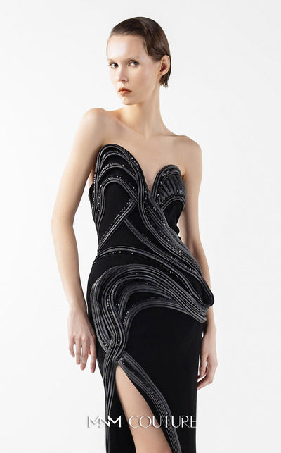 MNM Couture Style G2048 showcasing a strapless asymmetrical black crepe gown with anthracite lamé organza waves, crystal embellishments, and a dramatic thigh-high slit | Couture Shop LA