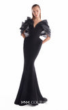 Black crepe mermaid gown MNM Couture Style G2110 with sculpted hips and voluminous blooming organza shoulders framing a V-neckline