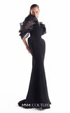 Black crepe mermaid gown MNM Couture Style G2110 with sculpted hips and voluminous blooming organza shoulders framing a V-neckline