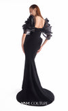 Black crepe mermaid gown MNM Couture Style G2110 with sculpted hips and voluminous blooming organza shoulders framing a V-neckline