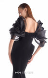 Black crepe mermaid gown MNM Couture Style G2110 with sculpted hips and voluminous blooming organza shoulders framing a V-neckline