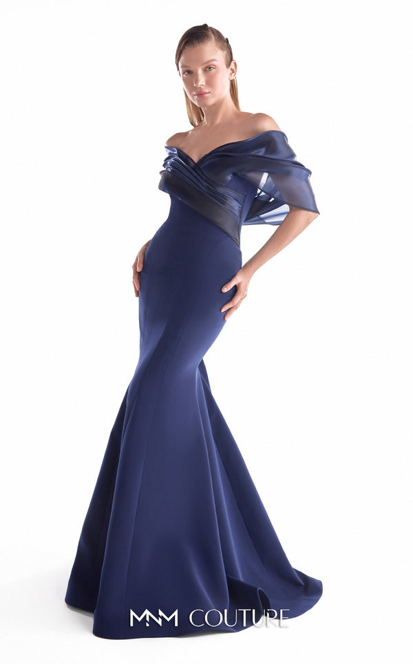 Navy crepe mermaid gown MNM Couture Style G2144 featuring an off-shoulder neckline with gracefully draped midnight blue liquid organza