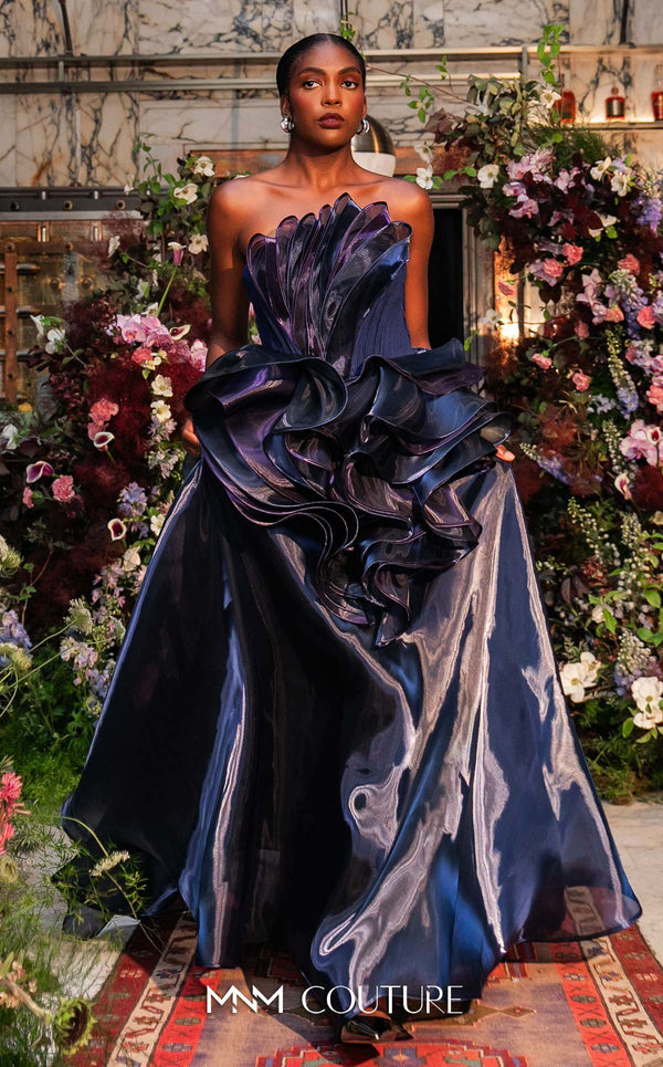 Strapless evening gown MNM Couture Style G2146 with cascading purple and navy fluid organza and a 3D floral waist bloom
