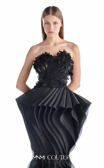 MNM Couture G2205 black organza and beaded lace mermaid gown with strapless illusion corset, hand-beaded floral lace appliqués, and sculptural pleated organza waves with train | Couture Shop LA.