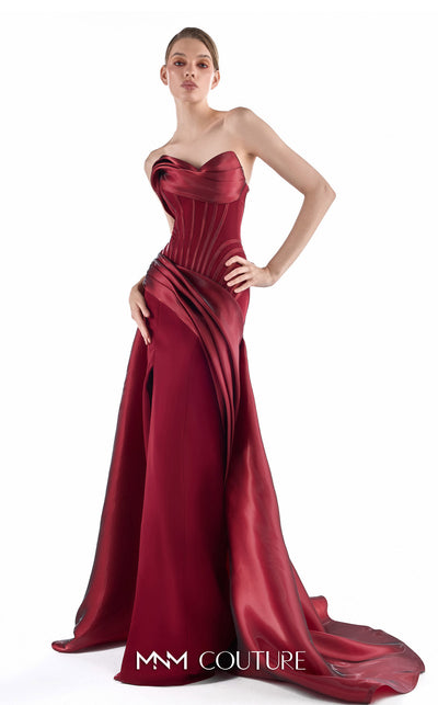 MNM Couture G2218 burgundy crystal organza and crepe strapless column gown with structured vertical-contour corset, draped overskirt, thigh-high slit, and dramatic train | Couture Shop LA.