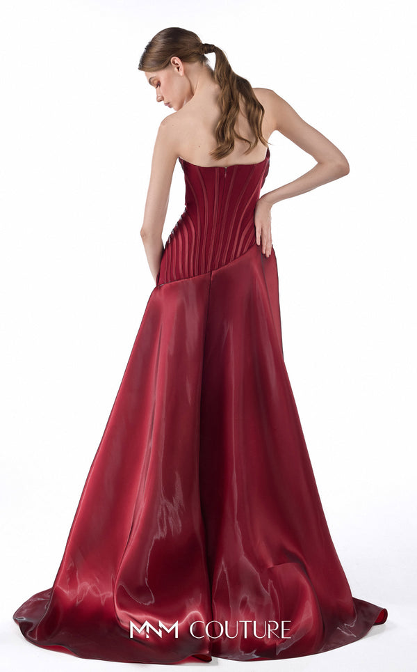 MNM Couture G2218 burgundy crystal organza and crepe strapless column gown with structured vertical-contour corset, draped overskirt, thigh-high slit, and dramatic train | Couture Shop LA.