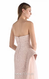 MNM Couture G2223 blush lace, crepe, and organza strapless column gown with intricate all-over embellishment, sculptural asymmetric peplum, and flowing organza overskirt with floor-length train | Couture Shop LA.