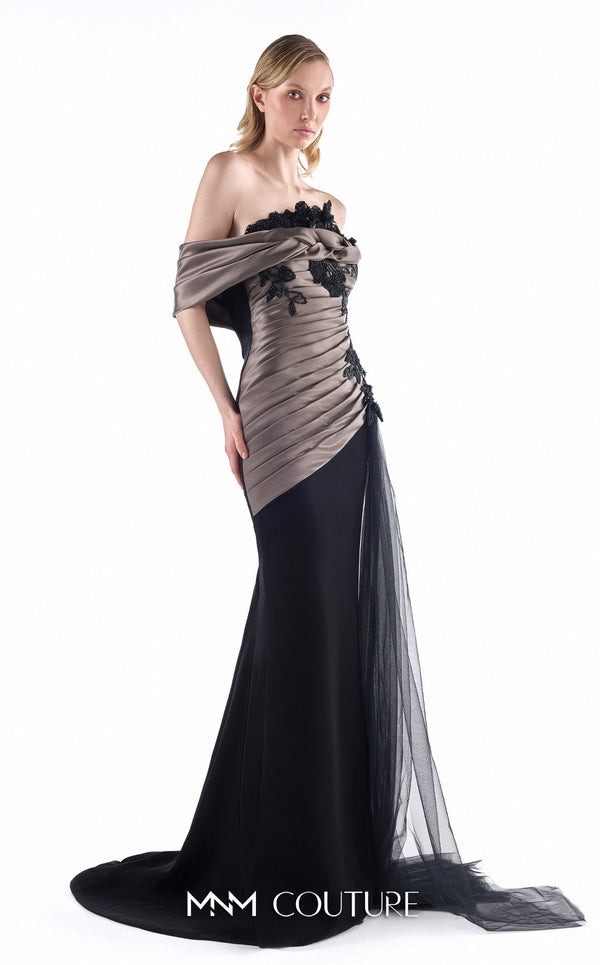 MNM Couture G2228 black crepe, mikado, and beaded black lace off-the-shoulder mermaid gown with sculptural draping and sheer tulle side cascade | Couture Shop LA.