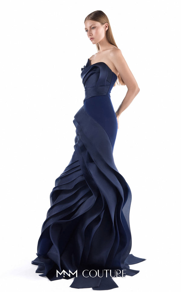 MNM Couture G2233 navy crepe and organza gommé asymmetrical off-shoulder mermaid gown with geometric asymmetric draping and layered cascading skirt | Couture Shop LA.