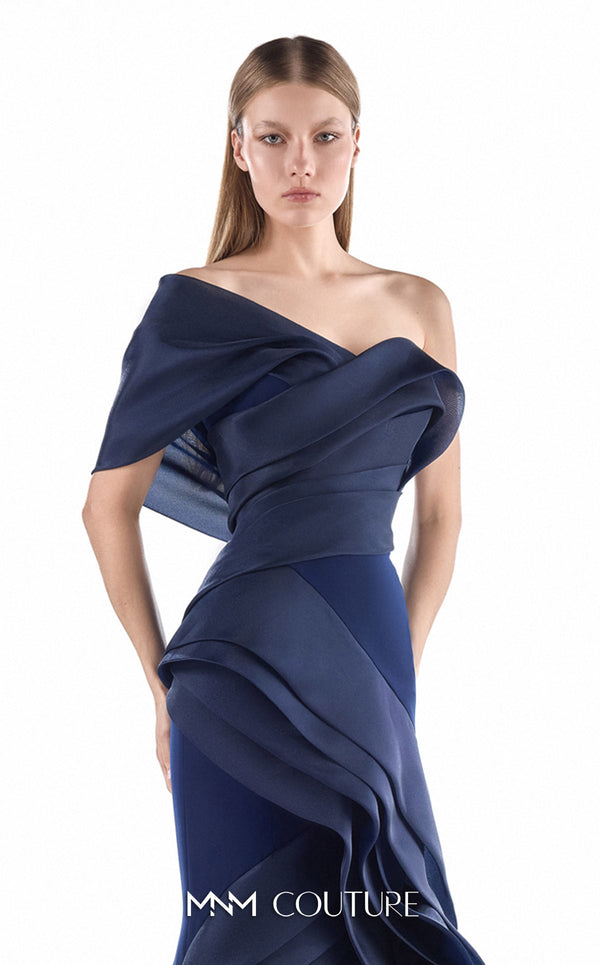 MNM Couture G2233 navy crepe and organza gommé asymmetrical off-shoulder mermaid gown with geometric asymmetric draping and layered cascading skirt | Couture Shop LA.