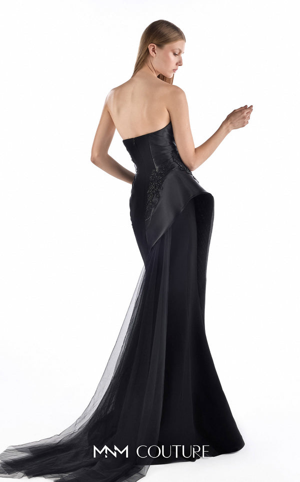 MNM Couture G2244 black beaded lace, organza, and tulle strapless fitted mermaid gown with sculpted neckline, architectural side peplum, and flowing tulle train | Couture Shop LA.