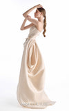 MNM Couture G2248 champagne crepe, lace, and crystal organza strapless column gown with sculpted bodice, hand-embroidered lace appliqués, draped crystal organza side panel, front slit, and sweeping train | Couture Shop LA.