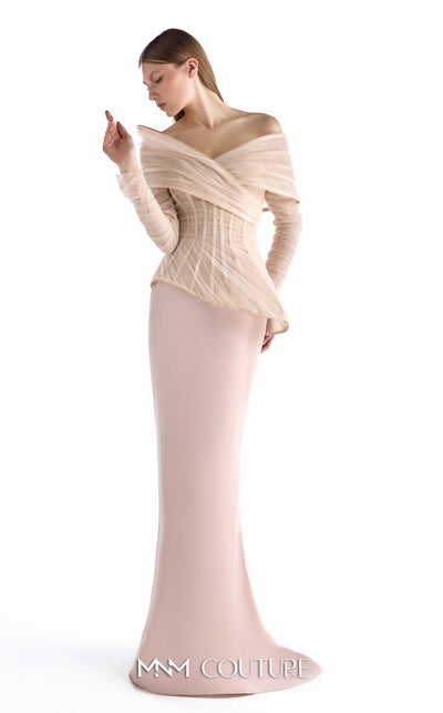 MNM Couture G2249 blush crepe and tulle off-the-shoulder column gown with sculpted corset bodice, layered tulle draping, asymmetrical peplum, sheer fitted long sleeves, and soft train | Couture Shop LA.