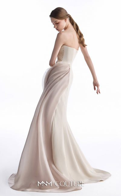 MNM Couture G2251 nude and blush beaded lace and Organza Gommé asymmetrical mermaid gown with hand-embellished lace bodice, sculptural Organza Gommé hip drape, and sweeping train | Couture Shop LA.