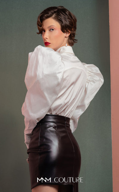 MNM Couture GOF2502 two-piece ensemble in coral mikado piqu�, featuring a structured asymmetrical peplum blazer and matching high-waisted, wide-leg pants. | Couture Shop LA