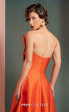 MNM Couture GOF2510 gown in vibrant red taffeta, featuring a dramatic off-shoulder neckline with cascading ruffles and a sleek, floor-length skirt. | Couture Shop LA