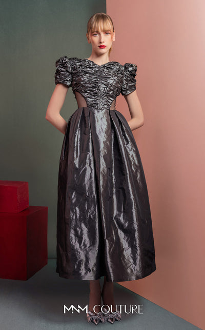 MNM Couture GOF2512 dress in anthracite taffeta, featuring a ruched bodice, voluminous puff sleeves, an A-line midi skirt, and transparent mesh side panels. | Couture Shop LA