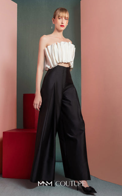 MNM Couture GOF2516 two-piece black-and-white ensemble, featuring a white pleated taffeta crop top and black high-waisted, wide-leg taffeta pants. | Couture Shop LA