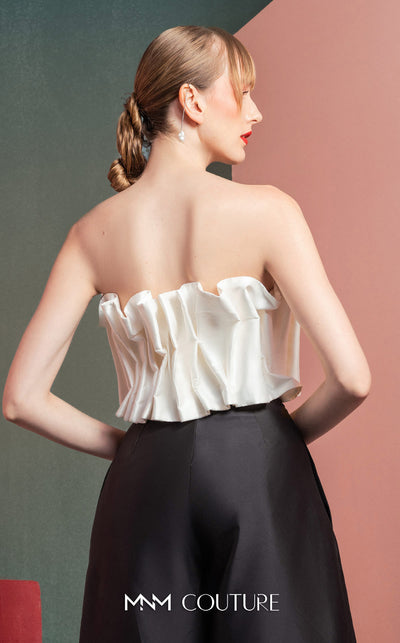 MNM Couture GOF2516 two-piece black-and-white ensemble, featuring a white pleated taffeta crop top and black high-waisted, wide-leg taffeta pants. | Couture Shop LA