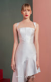 MNM Couture GOF2517 dress in white mikado piqué, featuring a structured bodice with thin straps and a gracefully flowing asymmetrical high-low skirt. | Couture Shop LA