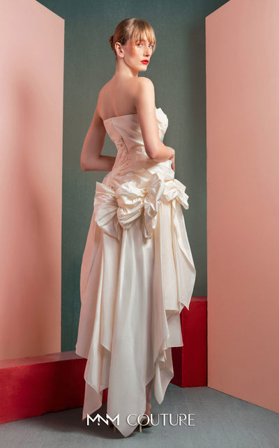 MNM Couture GOF2519 strapless dress in white taffeta, featuring a draped bodice, an asymmetrical hemline, and voluminous cascading ruffles down the side. | Couture Shop LA