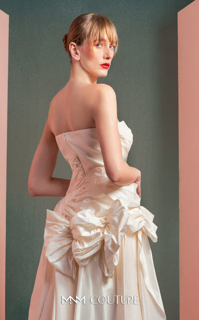 MNM Couture GOF2519 strapless dress in white taffeta, featuring a draped bodice, an asymmetrical hemline, and voluminous cascading ruffles down the side. | Couture Shop LA
