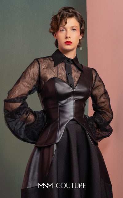 MNM Couture GOF2520 two-piece ensemble, featuring a black one-shoulder faux leather top and a matching black mikado piqué A-line skirt with leather side inserts. | Couture Shop LA