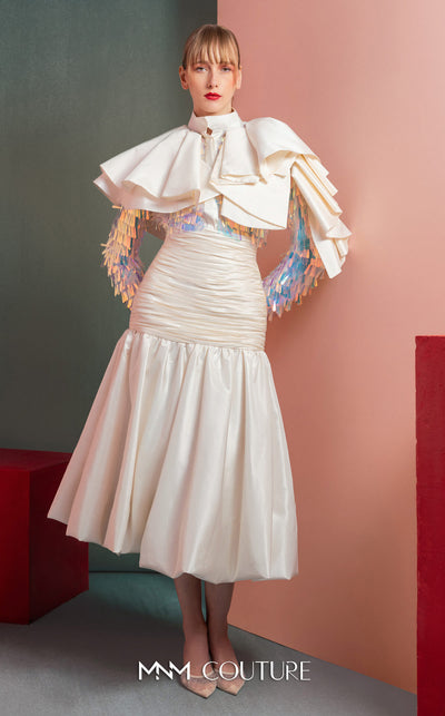 MNM Couture GOF2521 two-piece ensemble in white taffeta, featuring a top with dramatic shoulders and iridescent sequin embellishments, and a matching draped taffeta midi skirt. | Couture Shop LA