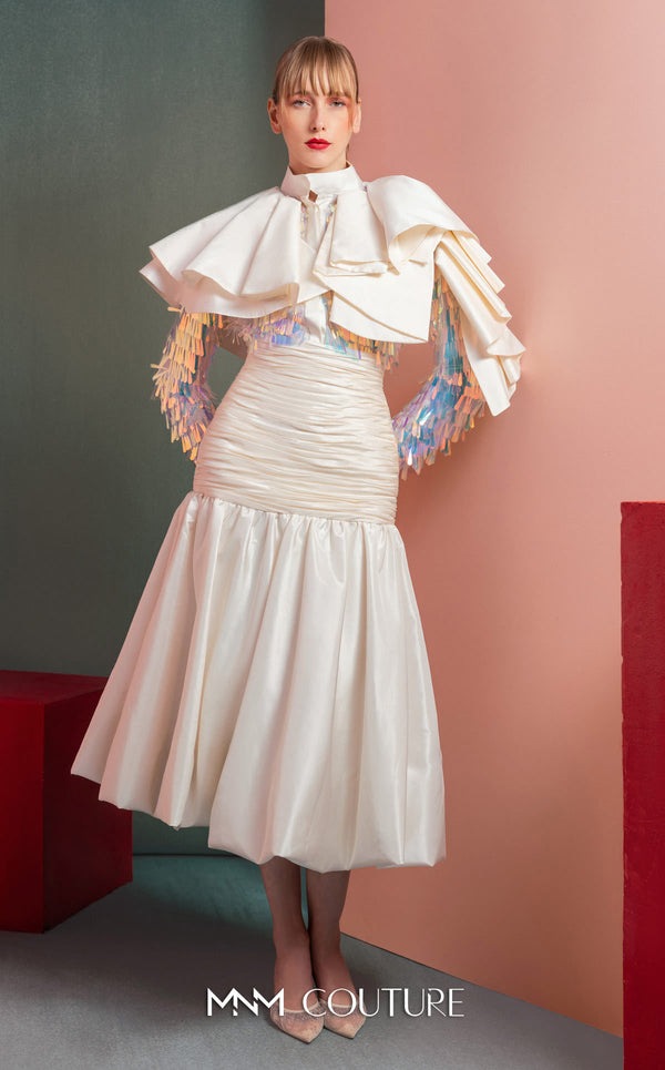 MNM Couture GOF2521 two-piece ensemble in white taffeta, featuring a top with dramatic shoulders and iridescent sequin embellishments, and a matching draped taffeta midi skirt. | Couture Shop LA