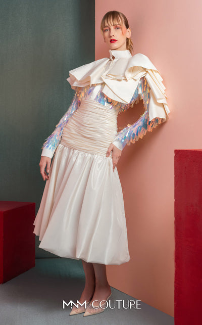 MNM Couture GOF2521 two-piece ensemble in white taffeta, featuring a top with dramatic shoulders and iridescent sequin embellishments, and a matching draped taffeta midi skirt. | Couture Shop LA