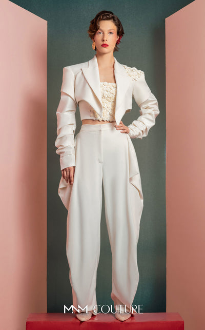 MNM Couture GOF2522 three-piece white ensemble, including wide-leg draped trousers, a floral corset top, and a cropped asymmetrical jacket with floral and ruched detailing. | Couture Shop LA