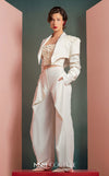 MNM Couture GOF2522 three-piece white ensemble, including wide-leg draped trousers, a floral corset top, and a cropped asymmetrical jacket with floral and ruched detailing. | Couture Shop LA