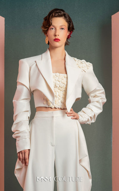 MNM Couture GOF2522 three-piece white ensemble, including wide-leg draped trousers, a floral corset top, and a cropped asymmetrical jacket with floral and ruched detailing. | Couture Shop LA