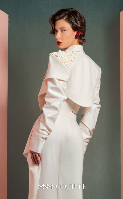 MNM Couture GOF2522 three-piece white ensemble, including wide-leg draped trousers, a floral corset top, and a cropped asymmetrical jacket with floral and ruched detailing. | Couture Shop LA
