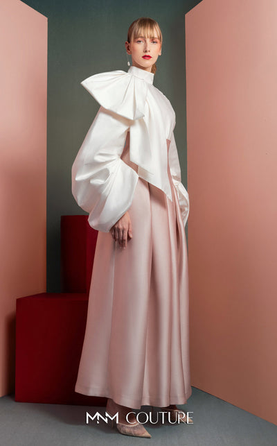 MNM Couture GOF2523 two-piece ensemble, featuring a white taffeta blouse with dramatically oversized sleeves and a front knot, paired with pink taffeta high-waisted, wide-leg pants. | Couture Shop LA
