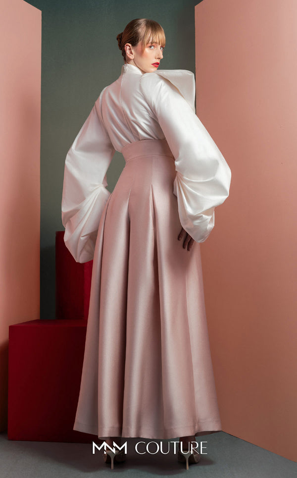 MNM Couture GOF2523 two-piece ensemble, featuring a white taffeta blouse with dramatically oversized sleeves and a front knot, paired with pink taffeta high-waisted, wide-leg pants. | Couture Shop LA