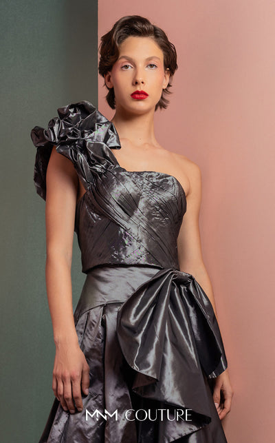 MNM Couture GOF2524 two-piece ensemble in metallic anthracite taffeta, featuring a one-shoulder top with a sculptural ruffle and a high-waisted skirt with matching oversized ruffles. | Couture Shop LA