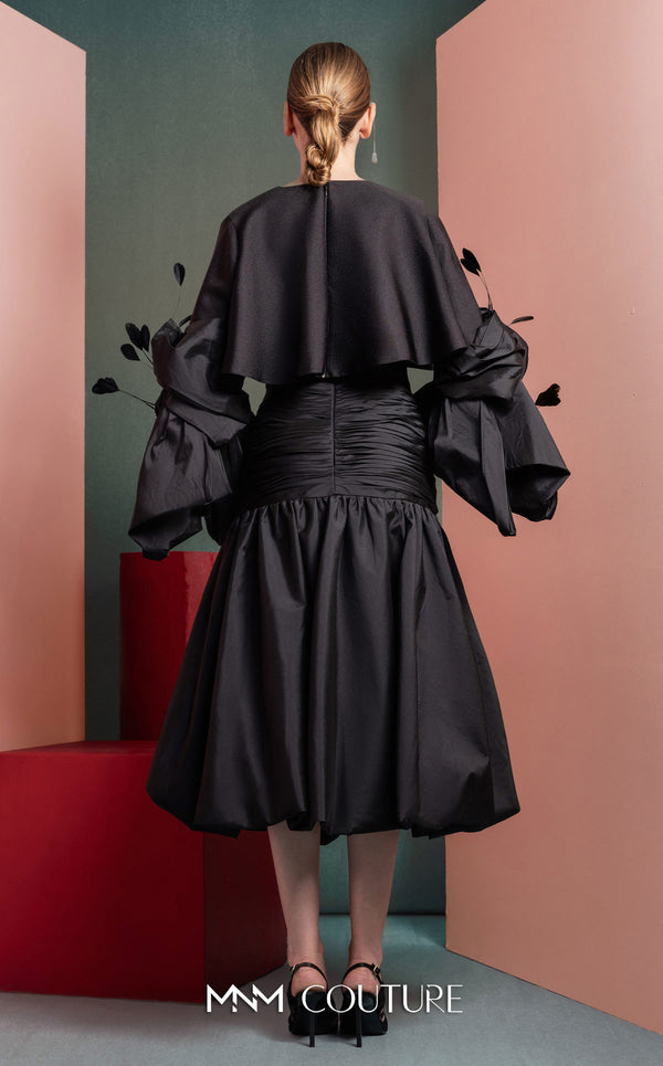 MNM Couture GOF2525 ball gown in black taffeta, featuring an elegantly draped bodice and a voluminous, floor-sweeping skirt. | Couture Shop LA