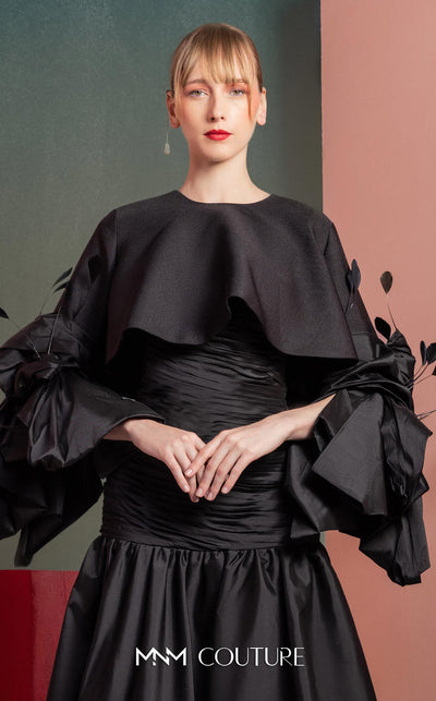 MNM Couture GOF2525 ball gown in black taffeta, featuring an elegantly draped bodice and a voluminous, floor-sweeping skirt. | Couture Shop LA