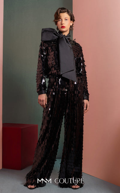 MNM Couture GOF2526 two-piece black sequin ensemble, featuring a long-sleeve blouse with a large taffeta bow at the neck and matching flared sequin pants. | Couture Shop LA
