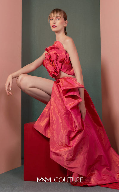 MNM Couture GOF2531 ensemble, featuring a dramatic fuchsia metallic taffeta high-low skirt and a matching sculptural top with a sequin-back finish. | Couture Shop LA