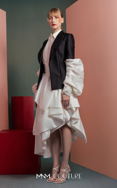 MNM Couture GOF2532 ensemble, featuring a high-low voluminous white taffeta skirt paired with a sharply tailored minimalist black blazer. | Couture Shop LA