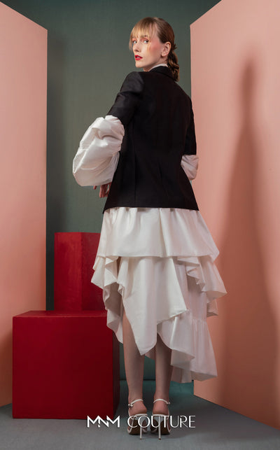 MNM Couture GOF2532 ensemble, featuring a high-low voluminous white taffeta skirt paired with a sharply tailored minimalist black blazer. | Couture Shop LA