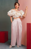 MNM Couture GOF2538 pink taffeta wide-leg pants ensemble with a voluminous off-shoulder ruffled crop top. | Couture Shop LA