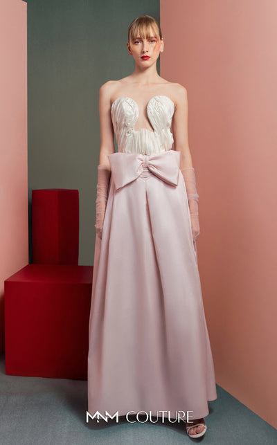 MNM Couture GOF2540 two-piece ensemble, featuring a structured white taffeta corset with draped detailing and a matching full-length taffeta skirt with a large bow accent at the waist. | Couture Shop LA