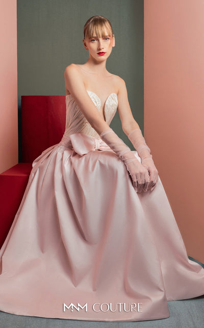 MNM Couture GOF2540 two-piece ensemble, featuring a structured white taffeta corset with draped detailing and a matching full-length taffeta skirt with a large bow accent at the waist. | Couture Shop LA