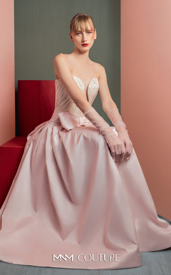 MNM Couture GOF2540 two-piece ensemble, featuring a structured white taffeta corset with draped detailing and a matching full-length taffeta skirt with a large bow accent at the waist. | Couture Shop LA