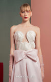 MNM Couture GOF2540 two-piece ensemble, featuring a structured white taffeta corset with draped detailing and a matching full-length taffeta skirt with a large bow accent at the waist. | Couture Shop LA