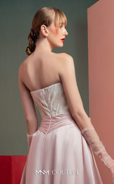 MNM Couture GOF2540 two-piece ensemble, featuring a structured white taffeta corset with draped detailing and a matching full-length taffeta skirt with a large bow accent at the waist. | Couture Shop LA